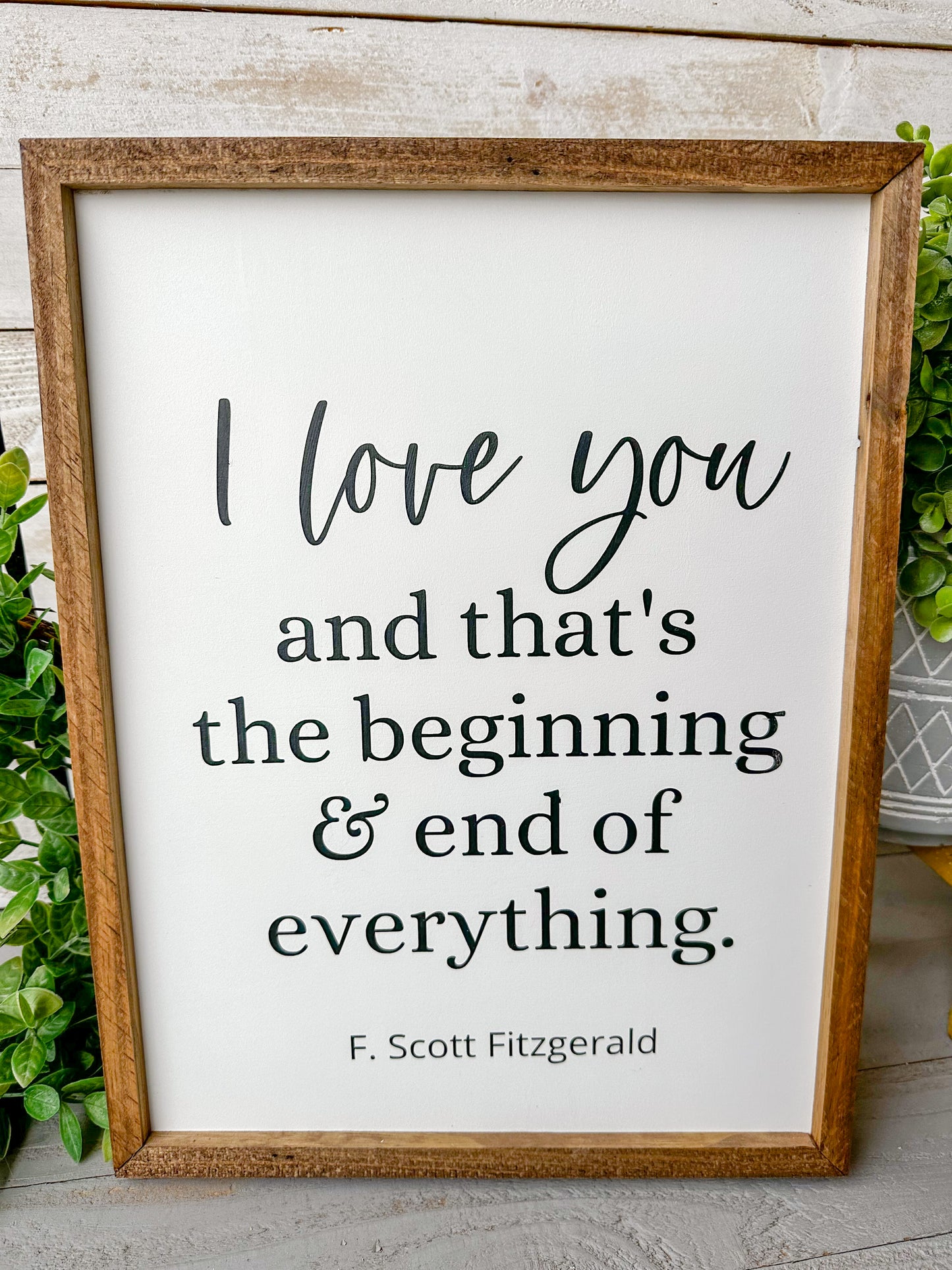 I love you and that’s the beginning & end of everything. Hand-painted wood sign.