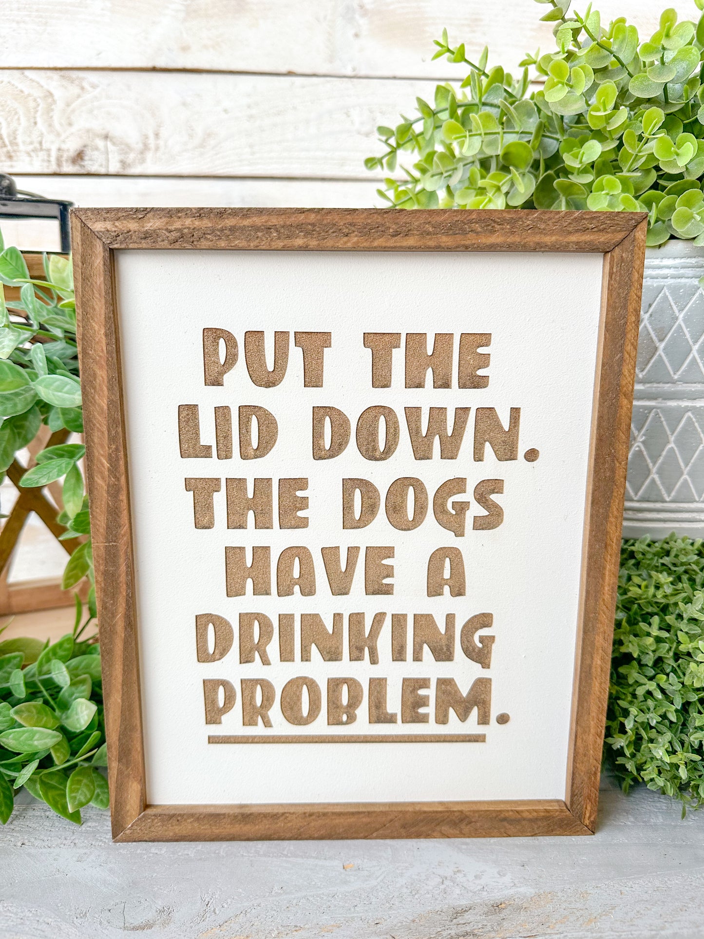 Put the lid down the dogs have a drinking problem. Laser engraved wood sign.
