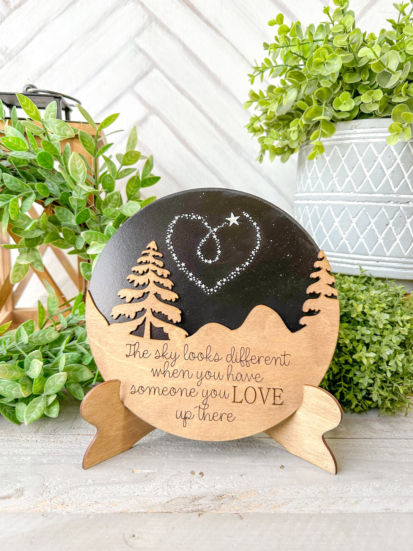 The sky looks a little different when you have someone you love up there. Wooden round with easel.