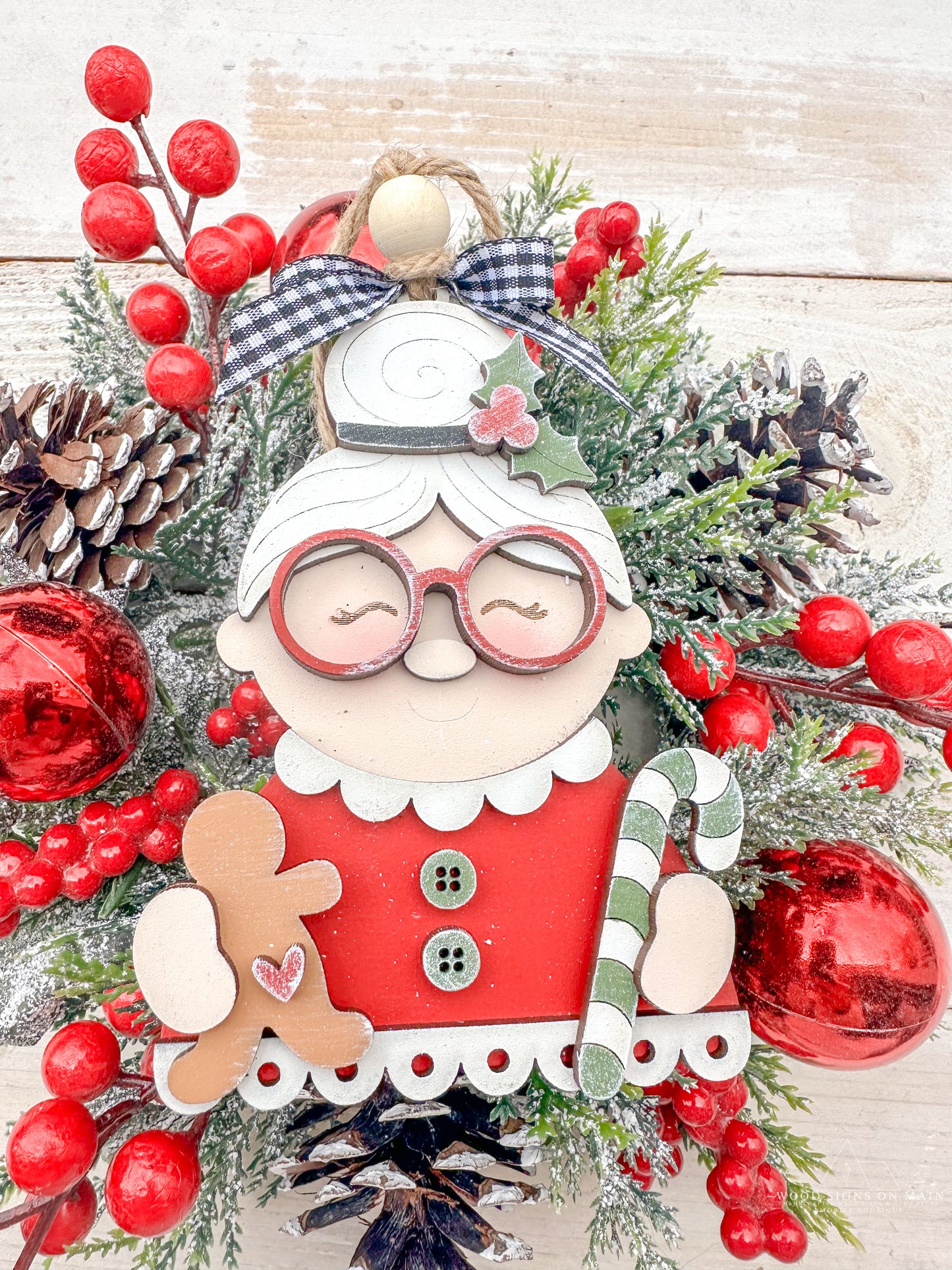 Mrs. Claus with glass, candy canes and ginger