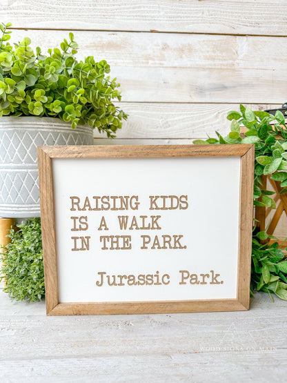 Rasing kids is a walk in the park...Jurassic Park laser engraved sign