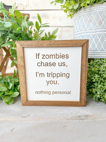 If zombies chase us, I’m tripping you nothing personal. Laser Engraved Wood Sign.