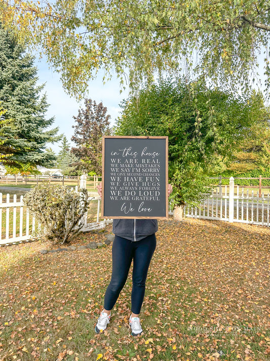In this house hand-painted wood sign