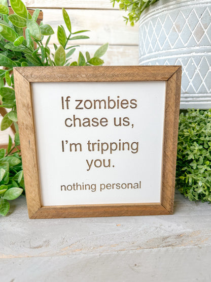 If zombies chase us, I’m tripping you nothing personal. Laser Engraved Wood Sign.
