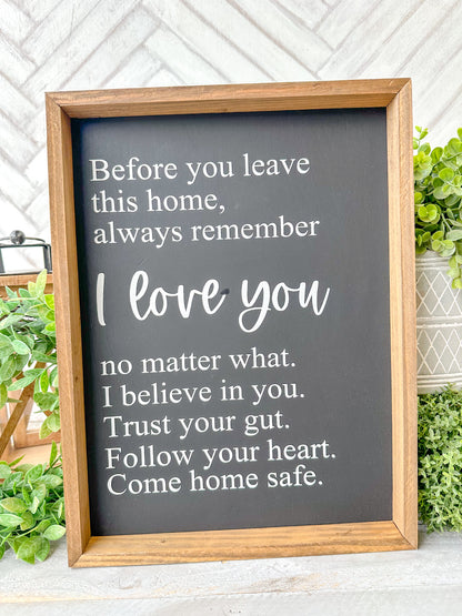 Before you leave this home, always remember I love you no matter what. I believe in you. Trust your gut. Trust your gut. Follow your your heart. Come home safe. Hand-painted wood sign.