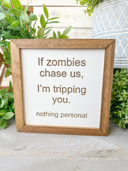 If zombies chase us, I’m tripping you nothing personal. Laser Engraved Wood Sign.