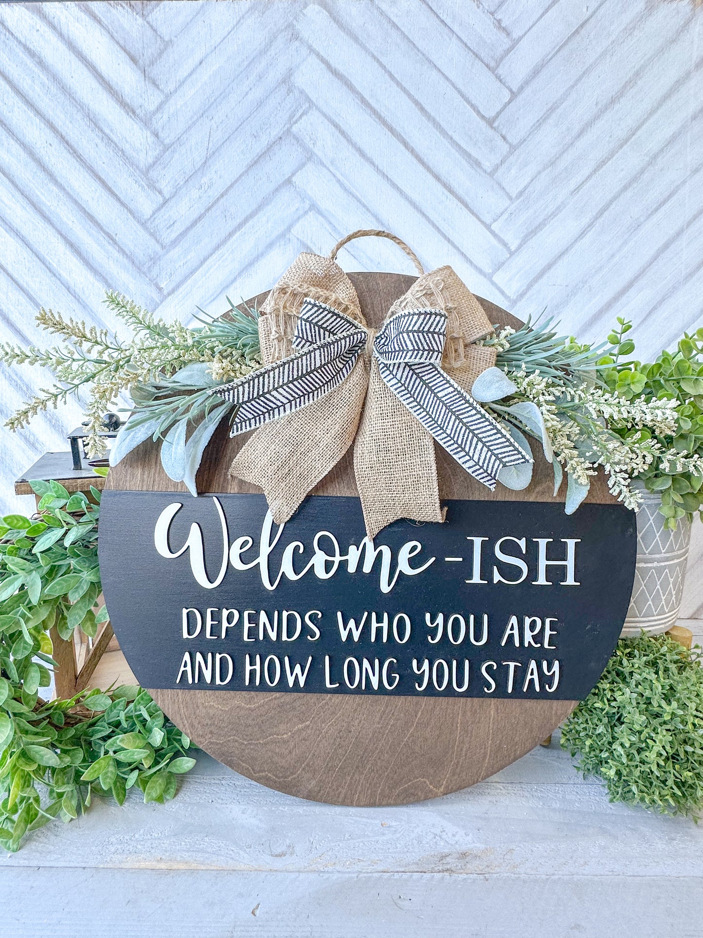 Funny Welcome-ish Sign - 18” Handcrafted Wood Round with Burlap Bow & Greenery