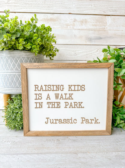Rasing kids is a walk in the park...Jurassic Park laser engraved sign