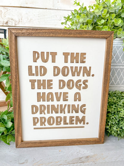 Put the lid down the dogs have a drinking problem. Laser engraved wood sign.