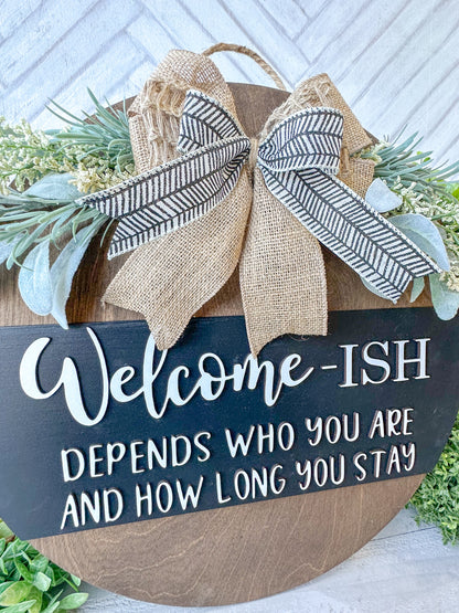 Funny Welcome-ish Sign - 18” Handcrafted Wood Round with Burlap Bow & Greenery