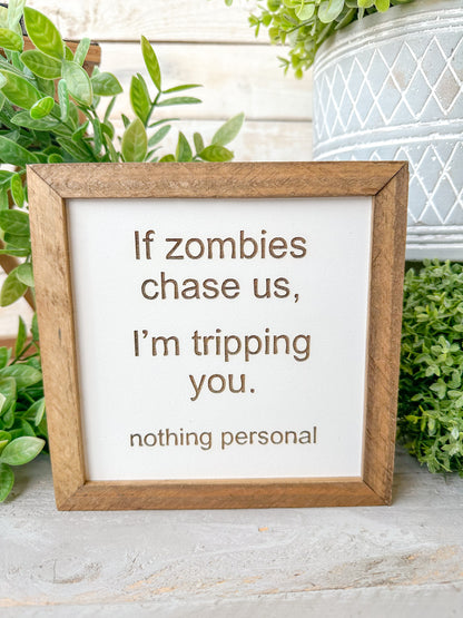 If zombies chase us, I’m tripping you nothing personal. Laser Engraved Wood Sign.