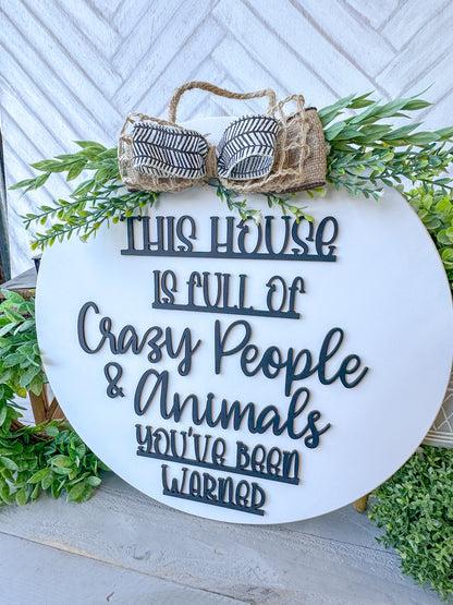 This house is full of crazy people & animals you’ve been warned. 18inch Door Hanger / Door Round.