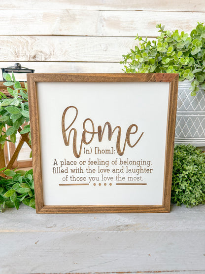 Home a place or filling of belonging, filled with love and laughter of those you love the most. Laser Engraved Wood Sign.