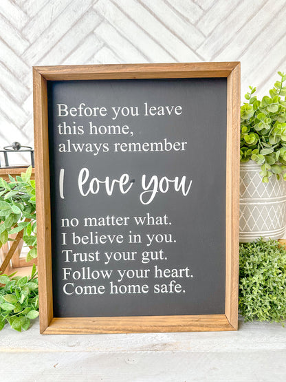 Before you leave this home, always remember I love you no matter what. I believe in you. Trust your gut. Trust your gut. Follow your your heart. Come home safe. Hand-painted wood sign.