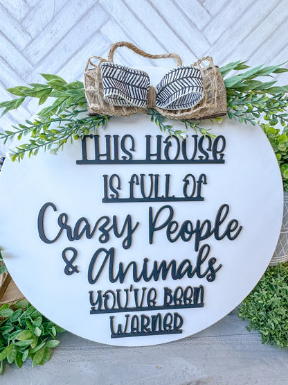 This house is full of crazy people & animals you’ve been warned. 18inch Door Hanger / Door Round.