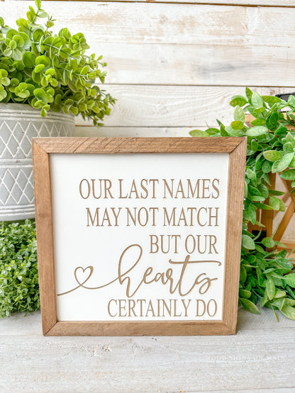 Our last names may not match but our hearts certainly do. Laser engraved wood sign.