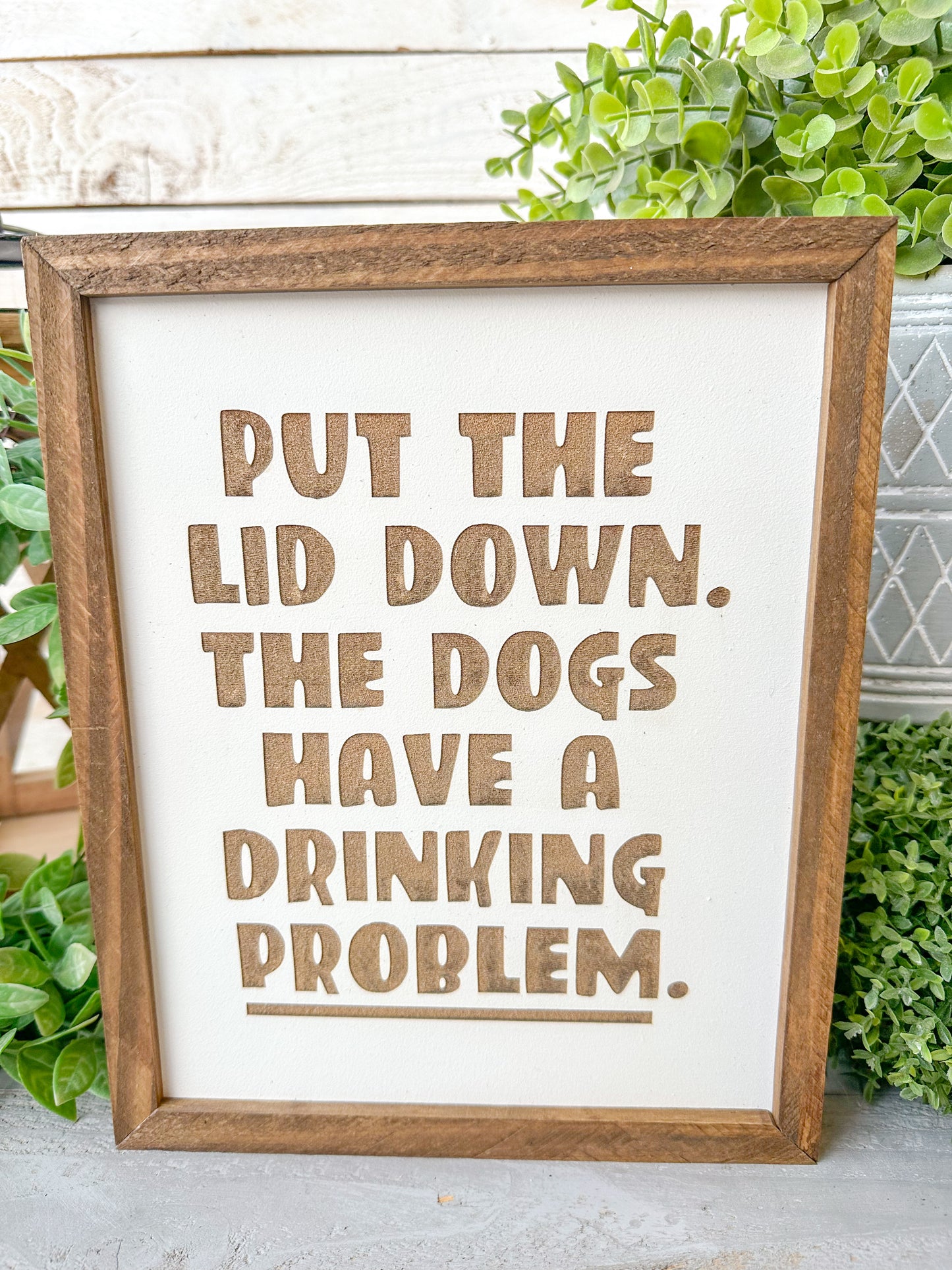 Put the lid down the dogs have a drinking problem. Laser engraved wood sign.