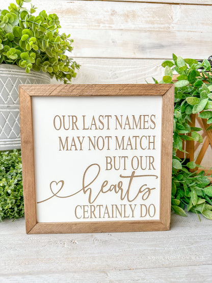Our last names may not match but our hearts certainly do. Laser engraved wood sign.