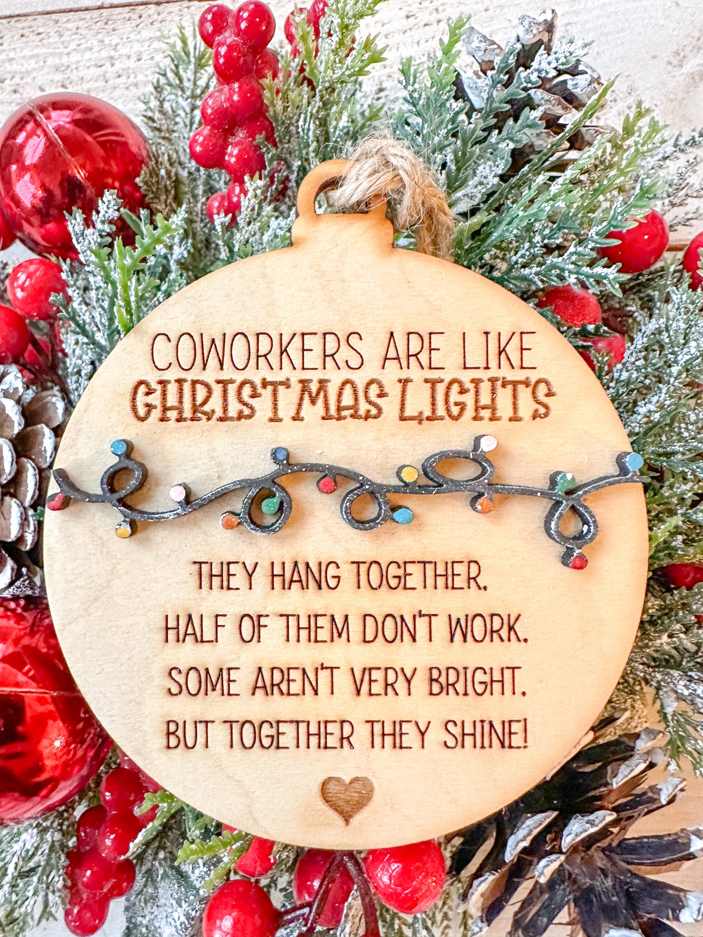 Coworkers are light Christmas lights ornaments