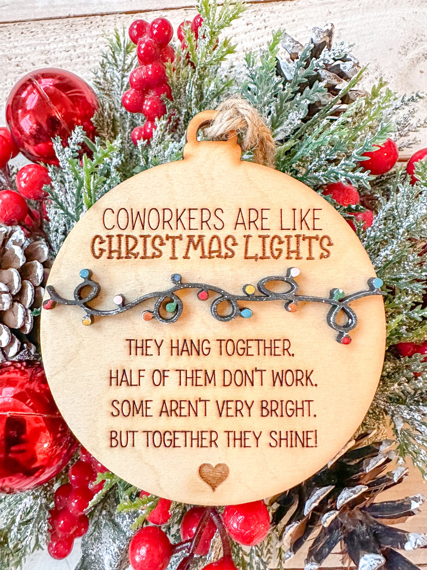 Coworkers are light Christmas lights ornaments