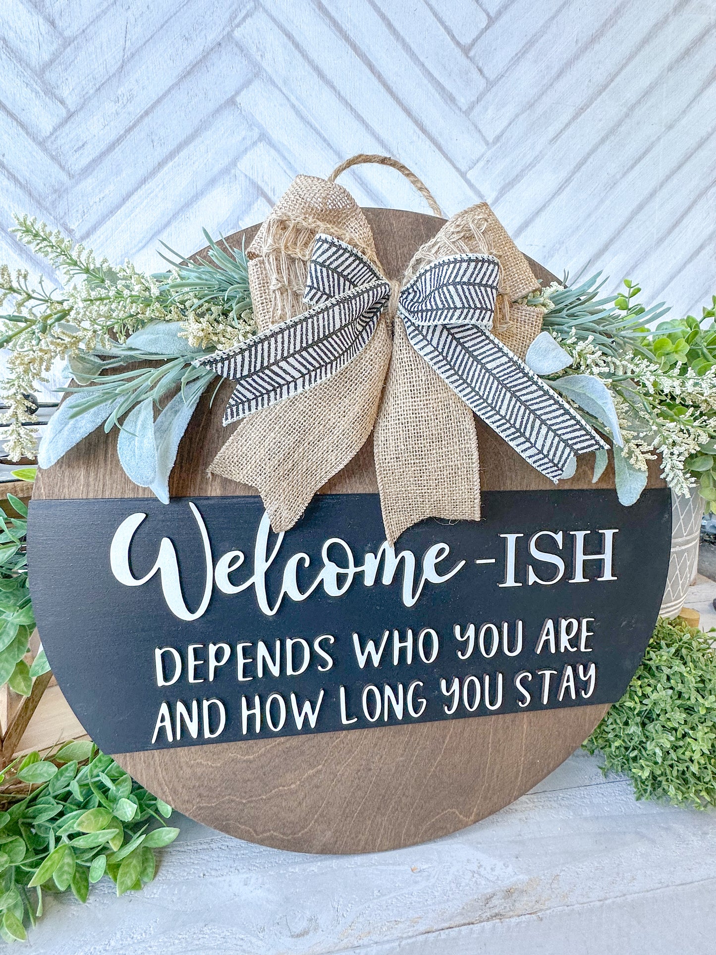 Funny Welcome-ish Sign - 18” Handcrafted Wood Round with Burlap Bow & Greenery