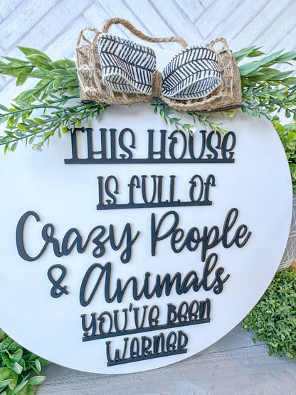 This house is full of crazy people & animals you’ve been warned. 18inch Door Hanger / Door Round.