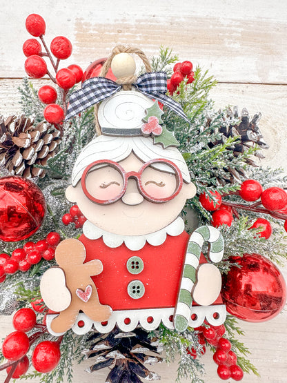 Mrs. Claus with glass, candy canes and ginger