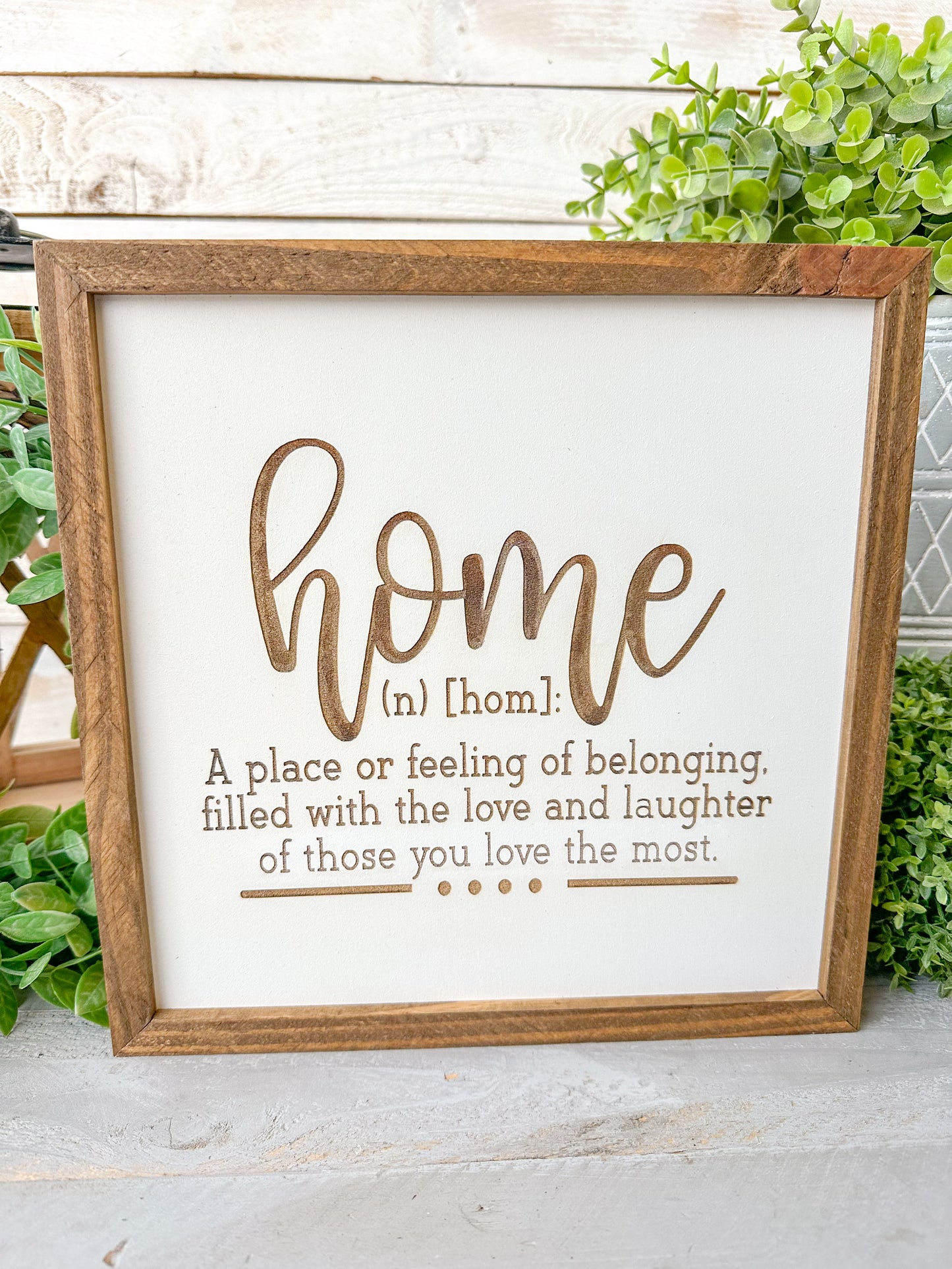 Home a place or filling of belonging, filled with love and laughter of those you love the most. Laser Engraved Wood Sign.