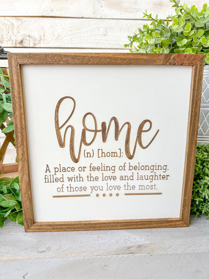 Home a place or filling of belonging, filled with love and laughter of those you love the most. Laser Engraved Wood Sign.