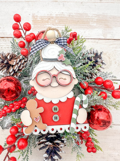 Mrs. Claus with glass, candy canes and ginger