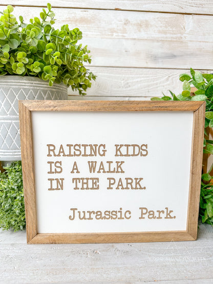 Rasing kids is a walk in the park...Jurassic Park laser engraved sign