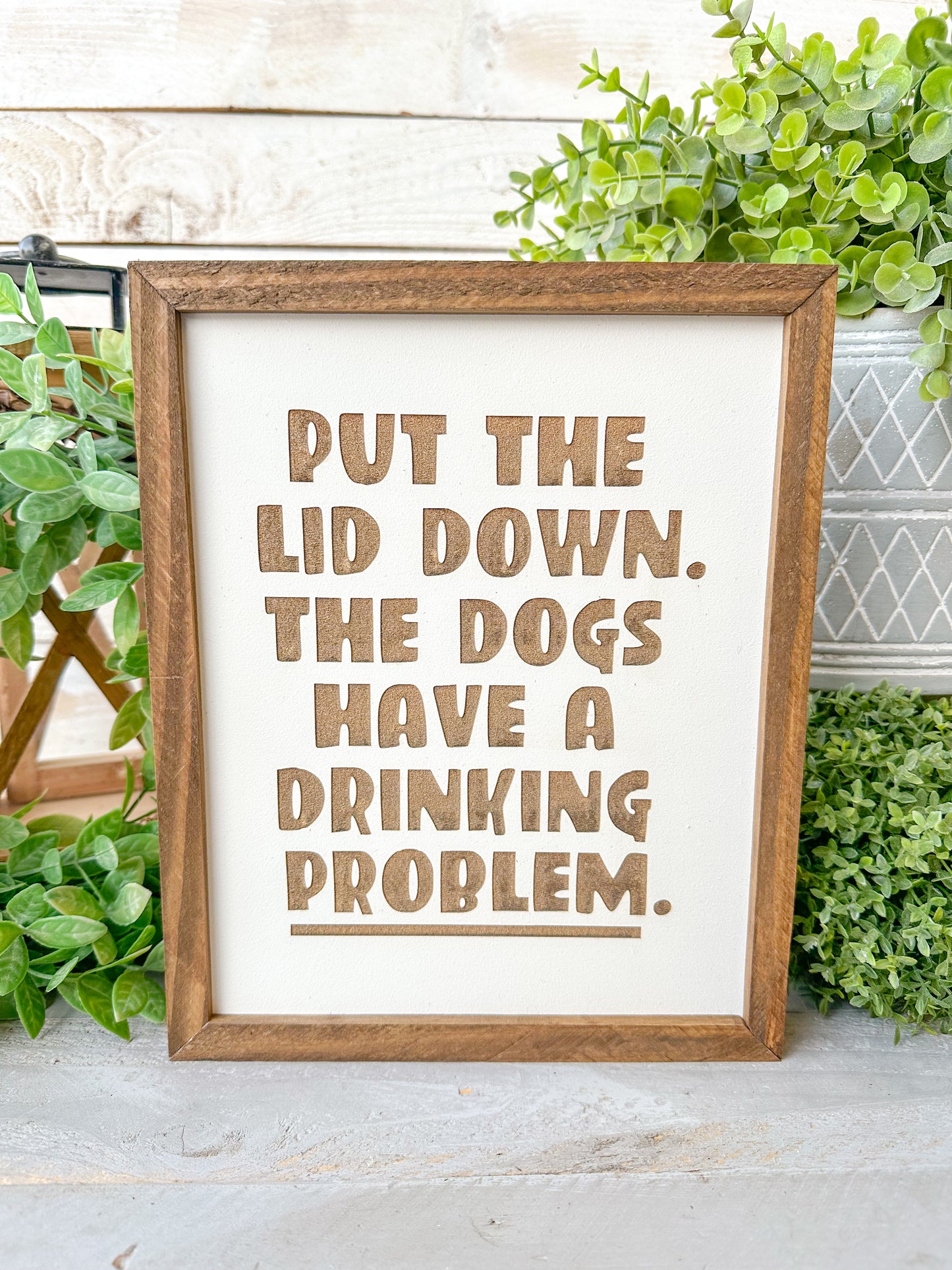 Put the lid down the dogs have a drinking problem. Laser engraved wood sign.