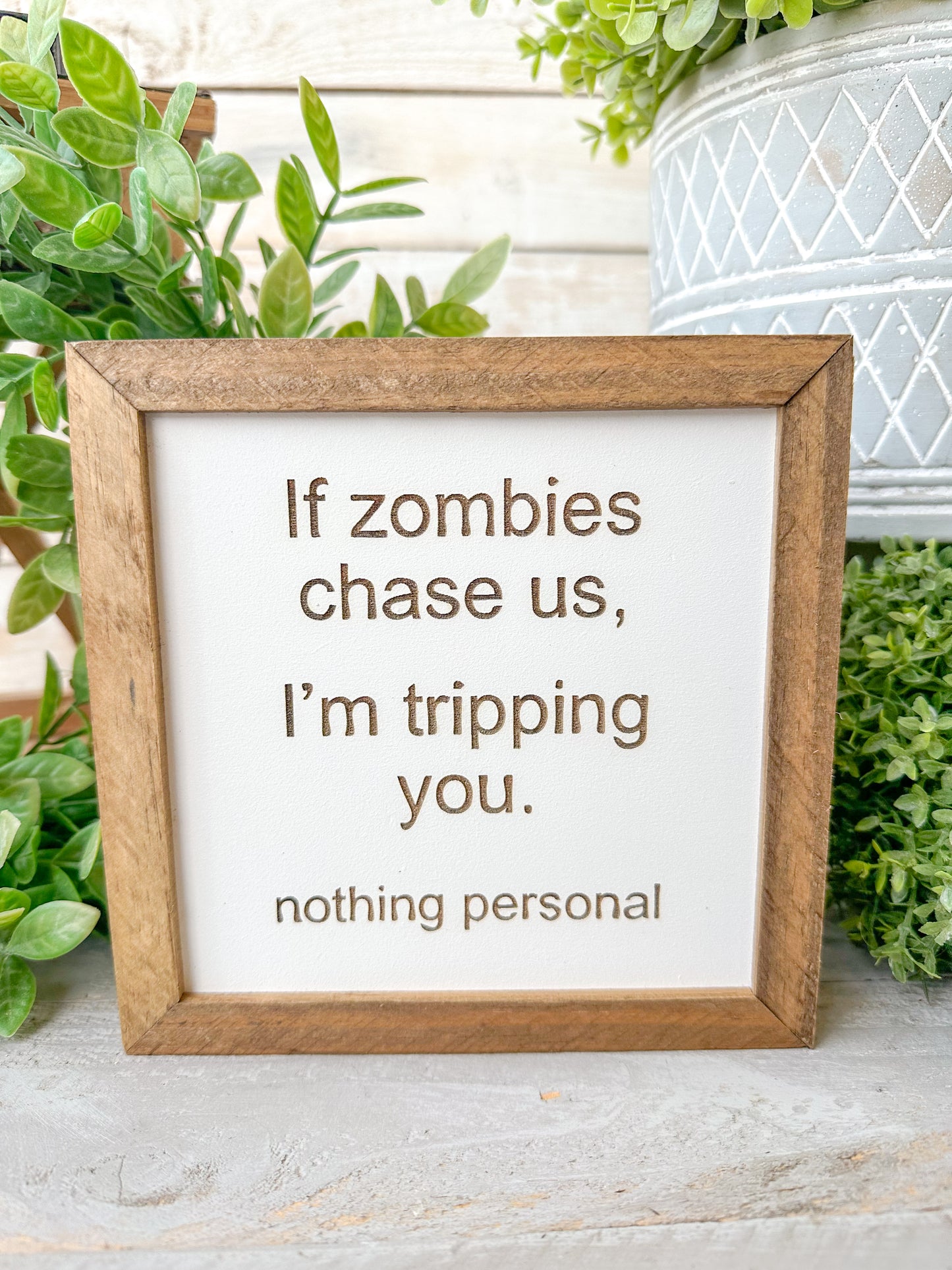 If zombies chase us, I’m tripping you nothing personal. Laser Engraved Wood Sign.