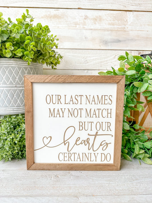 Our last names may not match but our hearts certainly do. Laser engraved wood sign.