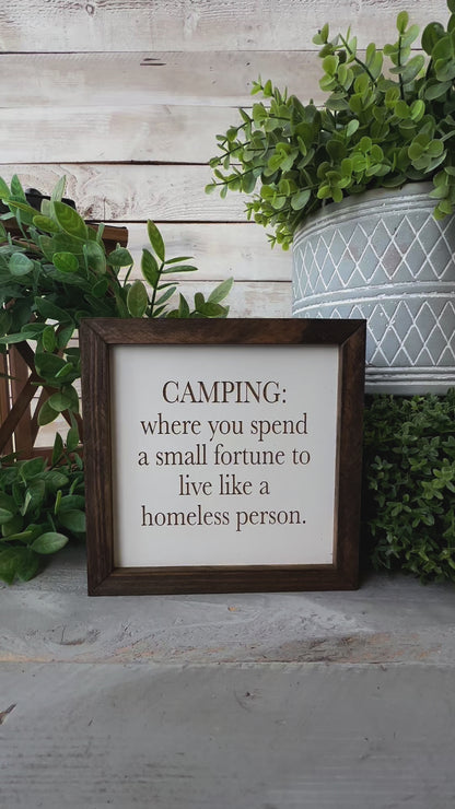 Camping where you spend a small fortune to live like a homeless person. Laser engraved wood sign.