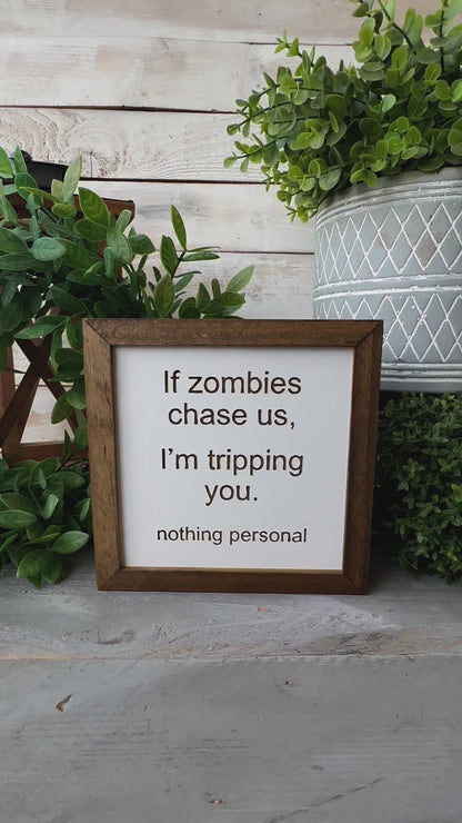 If zombies chase us, I’m tripping you nothing personal. Laser Engraved Wood Sign.