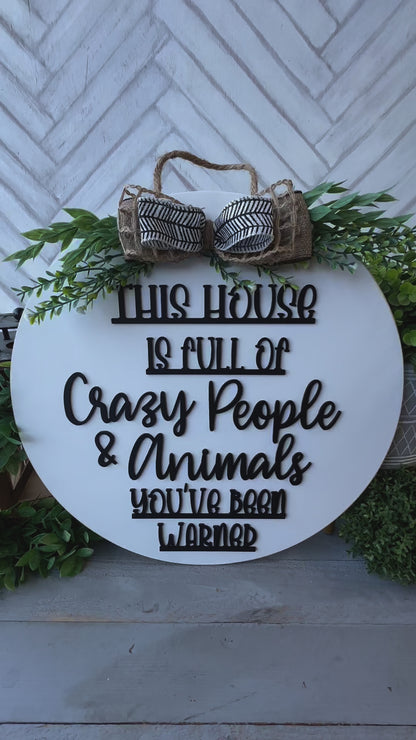 This house is full of crazy people & animals you’ve been warned. 18inch Door Hanger / Door Round.